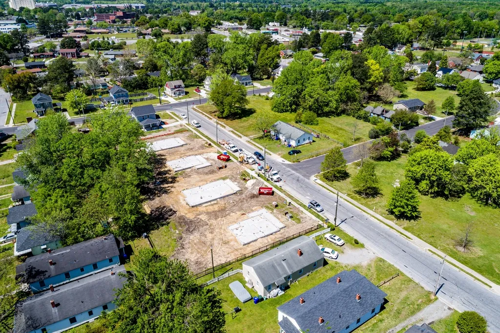 Aerial view of new home foundations on a suburban construction site